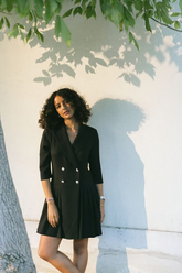 a lady wears a black blazer mini dress